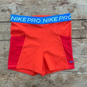 Nike Orange Athletic Shorts with Blue Waistband